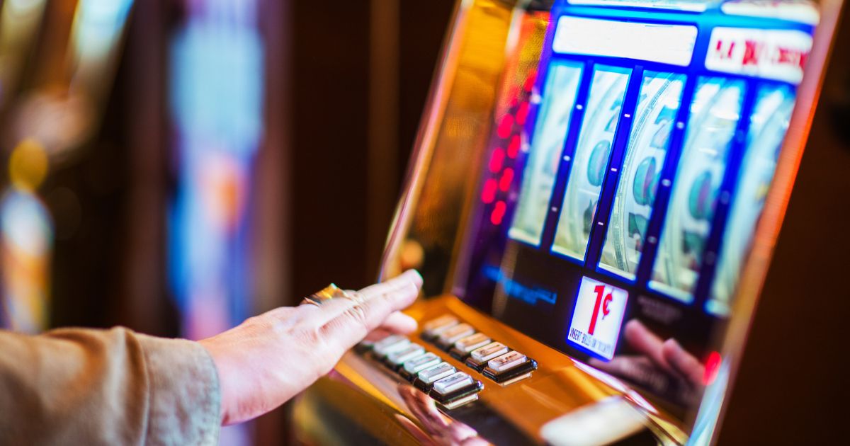 Casino slots with man hand clicking buttons